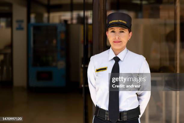 security guard working outside a building - security guard stock pictures, royalty-free photos & images