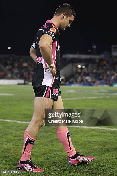 Tim Moltzen of the Tigers limps from the field during the round 16 NRL match between the Newcastle Knights and the Wests Tigers at Hunter Stadium on...
