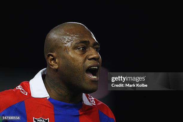 Akuila Uate of the Knights shouts instructions during the round 16 NRL match between the Newcastle Knights and the Wests Tigers at Hunter Stadium on...