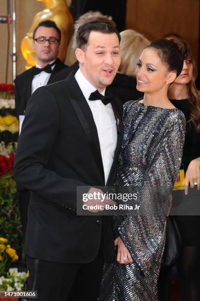 Portrait of engaged couple, musician Joel Madden and actress and fashion designer Nicole Richie, as they pose together at the Kodak Theater during...