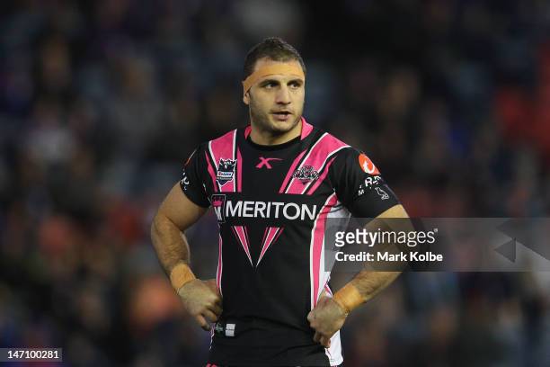 Robbie Farah of the Tigers looks on during the round 16 NRL match between the Newcastle Knights and the Wests Tigers at Hunter Stadium on June 25,...