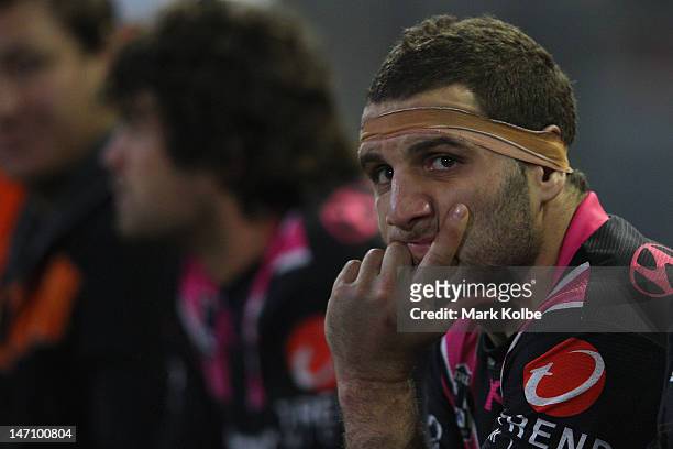 Robbie Farah of the Tigers looks on from the bench during the round 16 NRL match between the Newcastle Knights and the Wests Tigers at Hunter Stadium...