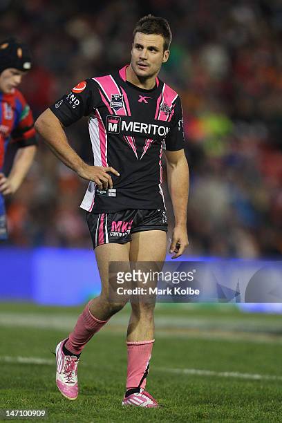 Beau Ryan of the Tigers looks dejected as he leaves the field after being sin binned during the round 16 NRL match between the Newcastle Knights and...
