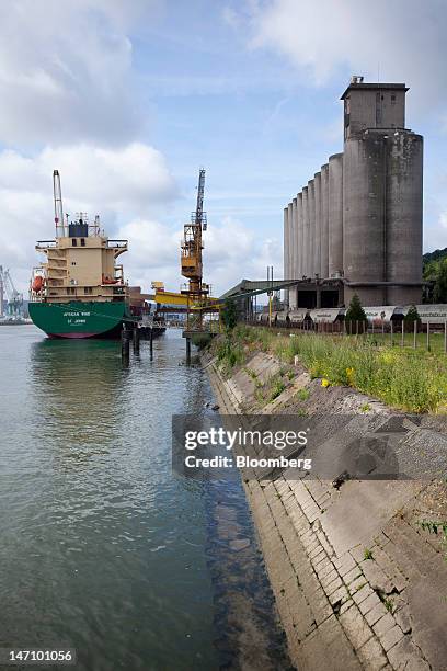 The "African Wind" cargo ship sits moored at Lecureur SA's cereal plant as grain is loaded into her hull, on the banks of the River Seine in Val de...