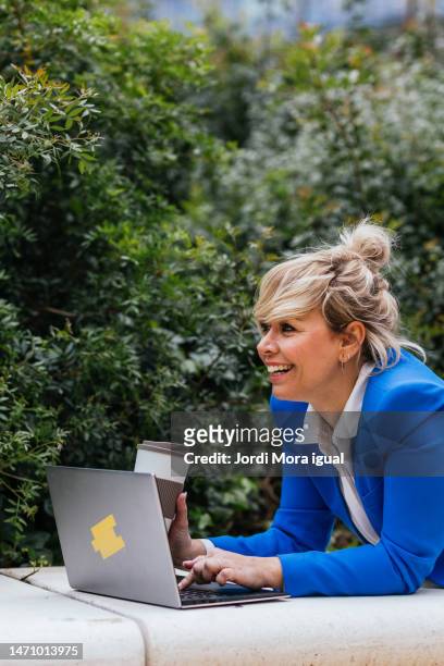 businesswoman lies on park bench while finishing her work with laptop. - free download photo stock pictures, royalty-free photos & images