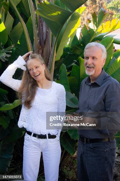 Suzy Amis Cameron and James Cameron pose for a photo during an interview at their home in 2013 in Malibu, California.