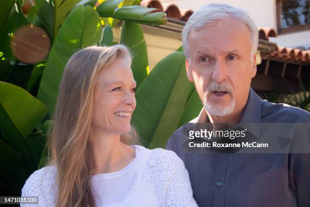 Suzy Amis Cameron and James Cameron pose for a photo during an interview at their home in 2013 in Malibu, California.