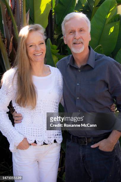 Suzy Amis Cameron and James Cameron pose for a photo during an interview at their home in 2013 in Malibu, California.