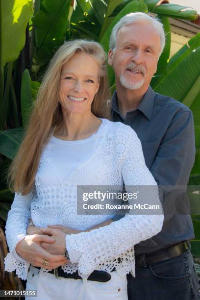 Suzy Amis Cameron and James Cameron pose for a photo while being interviewed in their garden in 2013 in Malibu, California.