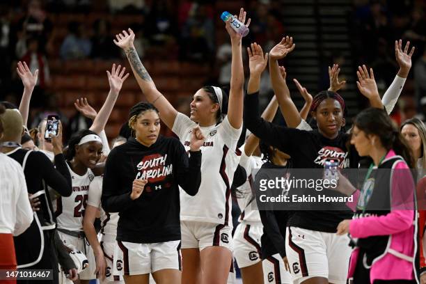 The South Carolina Gamecocks celebrate their win over the Arkansas Razorbacks during the quarterfinals of the SEC Women's Basketball Tournament at...