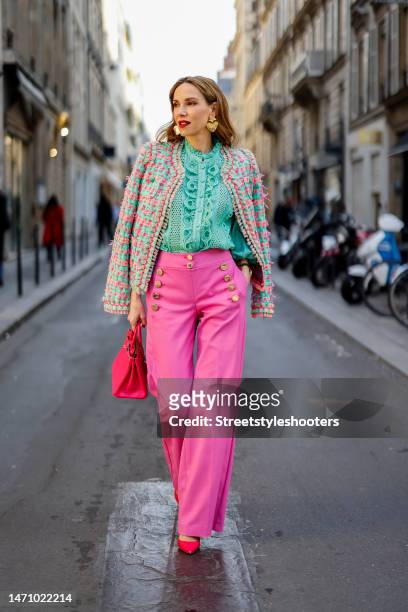 Alexandra Lapp is seen wearing MAISON COMMON tweed jacket in green and pink, MAISON COMMON ruffles blouse in green, MAISON COMMON flared trousers in...