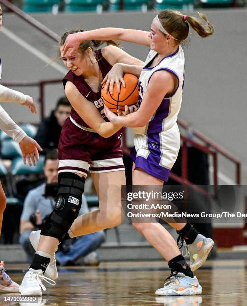 Joclyn Bassett of the Lutheran Lions tangles with Kaylee Padilla of the Berthoud Spartans during the first half of a Great 8 Colorado state high...