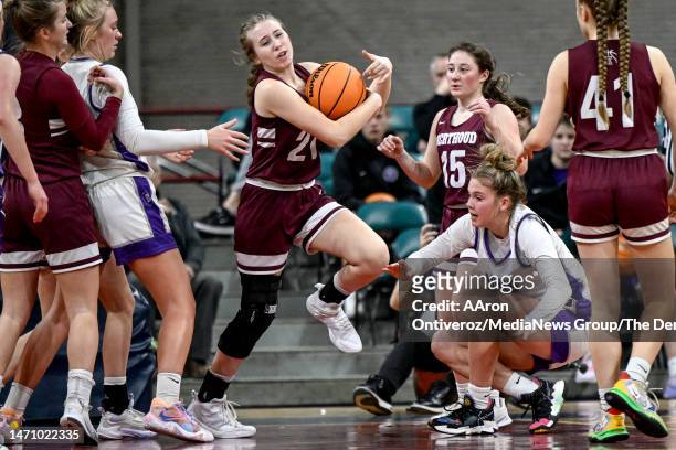 Kaylee Padilla of the Berthoud Spartans rips the ball from Raelyn Kelty of the Lutheran Lions during the first half of a Great 8 Colorado state high...