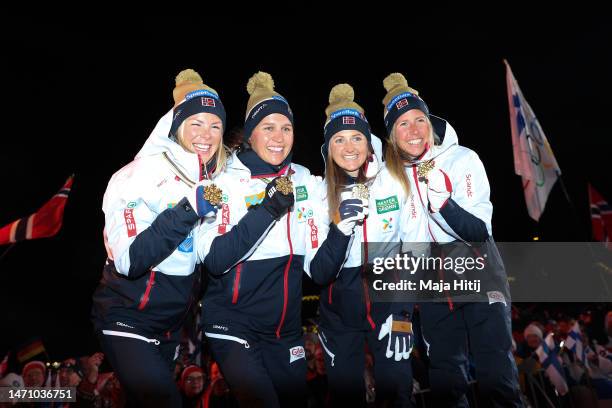 Gold medalists Anne Kjersti Kalvaa, Tiril Udnes Weng, Ingvild Flugstad Oestberg and Astrid Oeyre Slind of Team Norway celebrate during the medal...