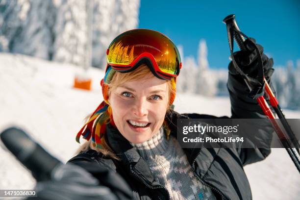 happy female skier portrait - ski poles stock pictures, royalty-free photos & images