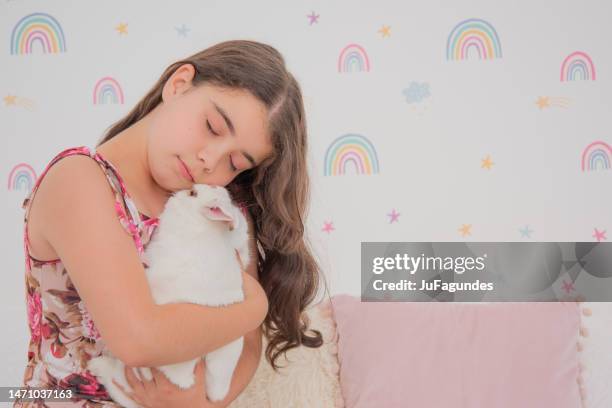 Girl Hugging Rabbit Photos and Premium High Res Pictures - Getty Images