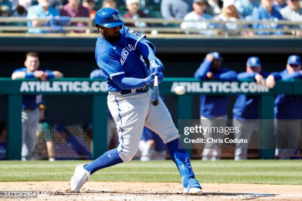 Franmil Reyes of the Kansas City Royals hits a single during the second inning of a spring training game against the Oakland Athletics at HoHoKam...