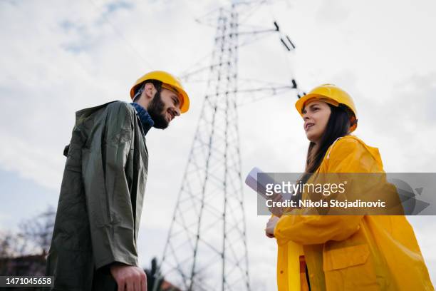 two young engineers and installation of electrical station - light meter stock pictures, royalty-free photos & images