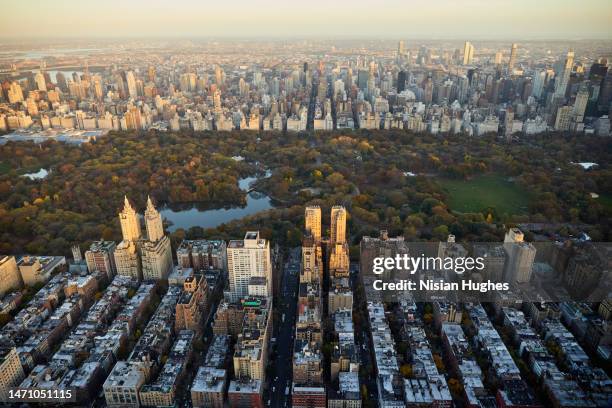 aerial photo taken over manhattan's upper west side looking at skyscrapers on the east side of central park - upper east side manhattan stock pictures, royalty-free photos & images