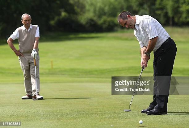 Buster Evans looks on as Matt Deal of Hendon Golf Club makes a putt on the 10th hole during the Virgin Atlantic PGA National Pro-Am Championship...