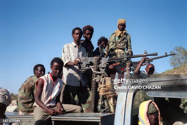 Somali Salvation democratic Front fitghers, armed, move in their military vehicul, 24 March 1991 in Bufo, 85 kilometers of Mogadiscio. President Siad...