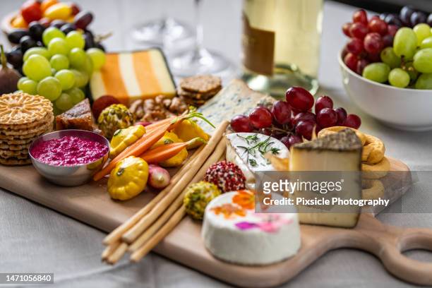 charcuterie cheese and fruit board - charcuterie stock-fotos und bilder