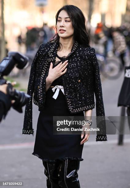 Shengyi Huang is seen wearing a balck Giambattista Valli outfit outside the Giambattista Valli show during Paris Fashion Week F/W 2023 on March 03,...