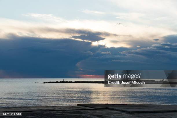 summer sunset over the sea horizon - umag stock pictures, royalty-free photos & images