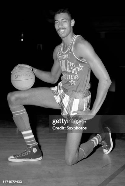 Wilt Chamberlain of the Harlem Globetrotters poses for a portrait in New York, New York, October 13, 1958. Chamberlain worked out with the 69th...