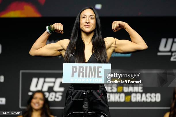 Jessica Penne poses on the scale during the UFC 285 ceremonial weigh-in at MGM Grand Garden Arena on March 03, 2023 in Las Vegas, Nevada.