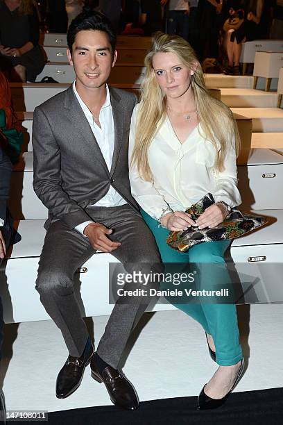 Alex Hua Tian and guest attend the Gucci show as part of Milan Fashion Week Menswear Spring/Summer 2013 on June 25, 2012 in Milan, Italy.