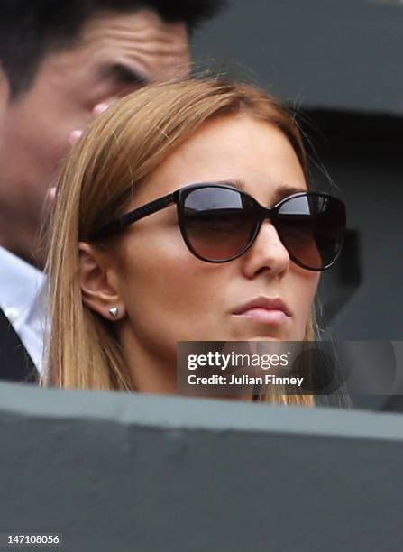 Jelena Ristic watches from the crowd during the gentlemen's singles first round match between Novak Djokovic of Serbia and Juan Carlos Ferrero of...