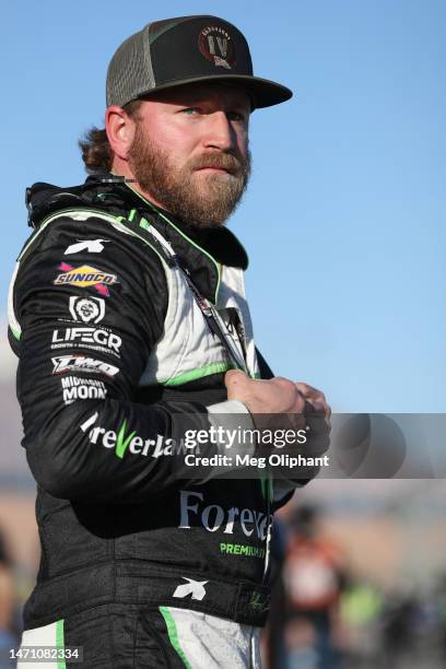 Jeffrey Earnhardt, driver of the Jesus Revolution - The Movie Chevrolet, looks on during practice for the NASCAR Xfinity Series Alsco Uniforms 300 at...