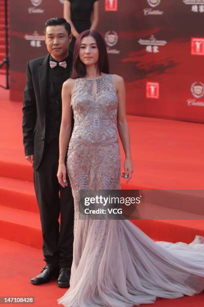 Actress Cecilia Cheung and actor Xiao Shenyang arrive at the red carpet during the closing ceremony for the 15th Shanghai International Film Festival...