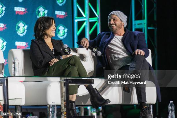 Neve Campbell and Skeet Ulrich speak onstage at the "What's Your Favorite Scary Movie? Scream Cast Reunion" during Emerald City Comic Con at Seattle...