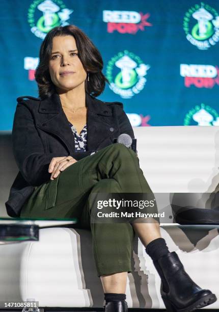 Neve Campbell speaks onstage at the "What's Your Favorite Scary Movie? Scream Cast Reunion" during Emerald City Comic Con at Seattle Convention...