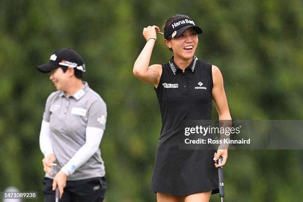 Lydia Ko of New Zealand and Eun Hee Ji of South Korea react on the ninth green during Day Three of the HSBC Women's World Championship at Sentosa...