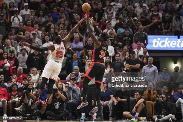 Julius Randle of the New York Knicks attempts a jump shot while being defended by Bam Adebayo of the Miami Heat during the second half at Miami-Dade...