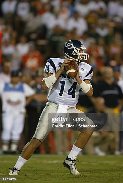 Dan Orlovsky of Connecticut looks for a receiver during the NCAA football game against the University of Miami at the Orange Bowl in Miami, Florida...