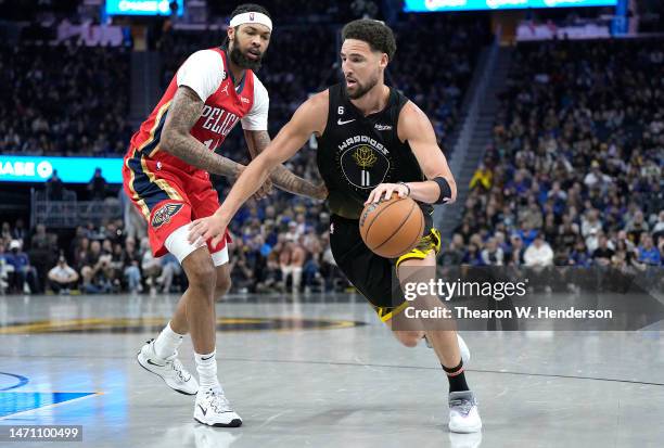Klay Thompson of the Golden State Warriors drives towards the basket on Brandon Ingram of the New Orleans Pelicans during the second quarter at Chase...