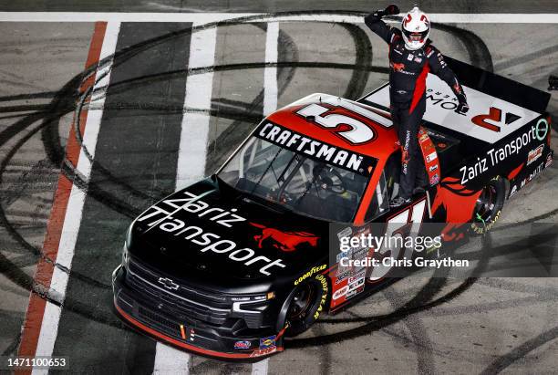 Kyle Busch, driver of the Zariz Transport Chevrolet, celebrates after winning the NASCAR CRAFTSMAN Truck Series Victoria's Voice Foundation 200 at...