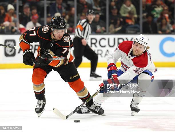 Frank Vatrano of the Anaheim Ducks and Rem Pitlick of the Montreal Canadiens skate after the puck during the second period at Honda Center on March...