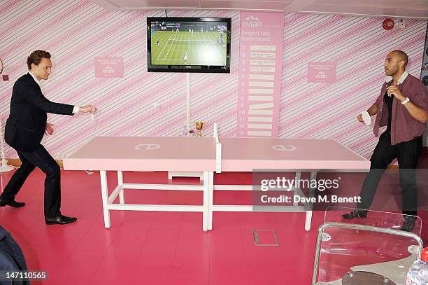 Tom Hiddleston and Alex Lanipekun attend the evian 'Live young' VIP Suite at Wimbledon on June 25, 2012 in London, England.