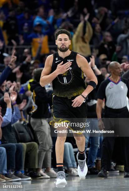 Klay Thompson of the Golden State Warriors reacts after making a three-point shot against the New Orleans Pelicans during the fourth quarter at Chase...