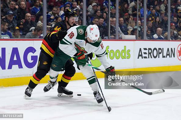 Kyle Burroughs of the Vancouver Canucks defends against Jordan... News ...
