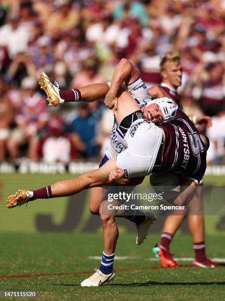 Reed Mahoney of the Bulldogs tackles Reuben Garrick of the Sea Eagles during the round one NRL match between the Manly Sea Eagles and the Canterbury...