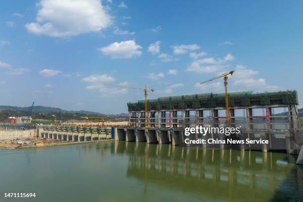Workers at the construction site of the Longxikou Natigation and Hydropower Hub on Minjiang River on March 3, 2023 in Qianwei County, Leshan City,...