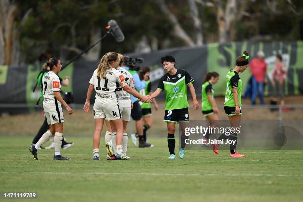 Chengshu Wu of Canberra United and Isabel Hodgson of Adelaide United shake hands after Canberra United win the round 16 A-League Women's match...