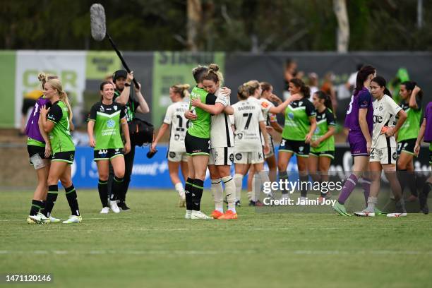 Michelle Heyman of Canberra United and Jenna McCormick of Adelaide United hug at the end of the match as Canberra United win the round 16 A-League...