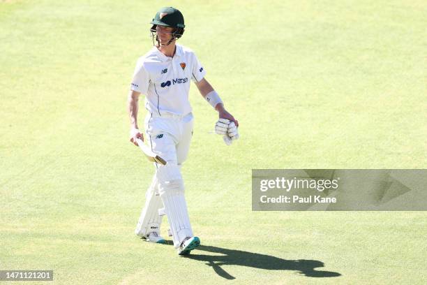 Jordan Silk of Tasmania walks from the field after being dismissed by Aaron Hardie of Western Australia during the Sheffield Shield match between...